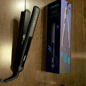 Equinox flat iron with universal voltage. Comes with box and instructions.